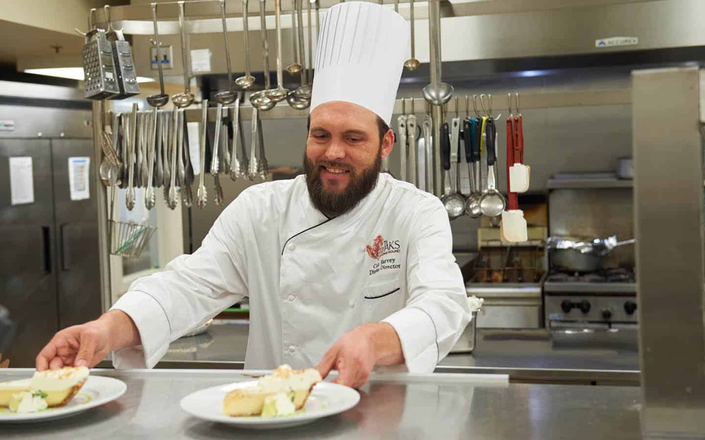 chef staging a couple pieces of pie