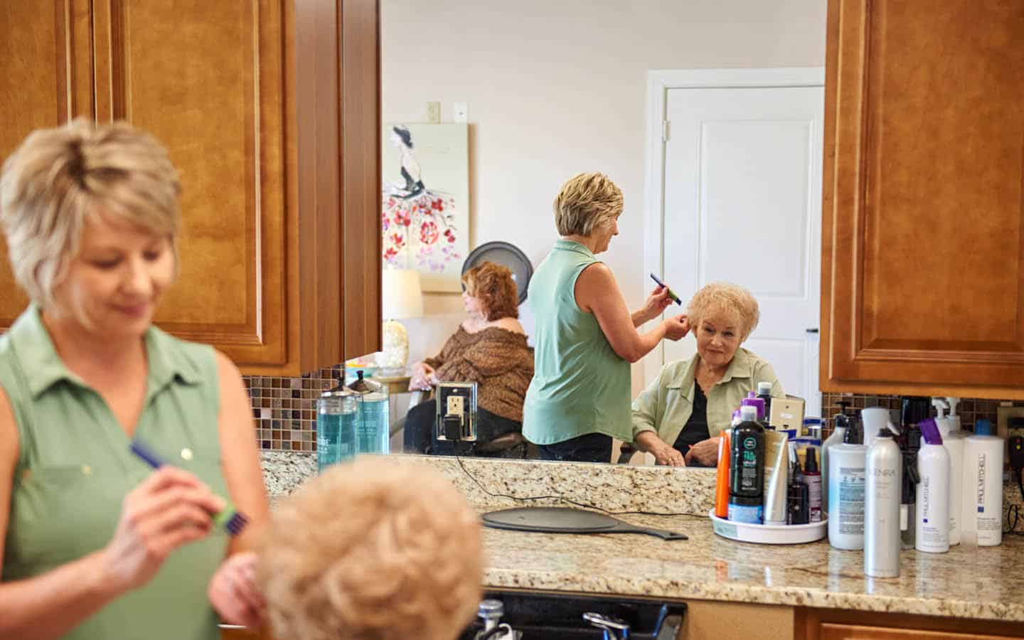 resident getting her hair styled at the salon