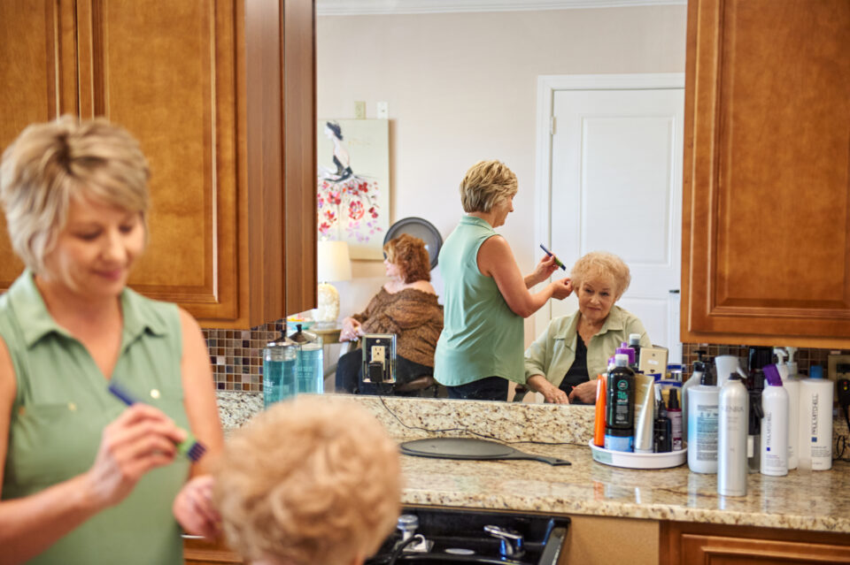 resident getting her hair done at the salon