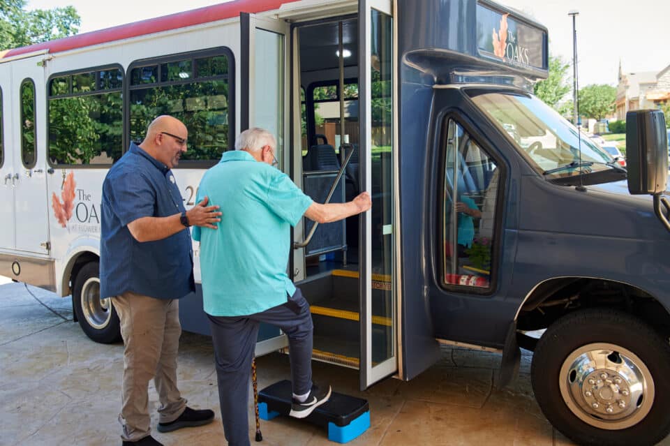 resident boarding the bus to go on an outing